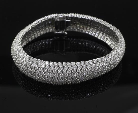 A modern 18ct white gold and diamond encrusted bracelet, 18cm.